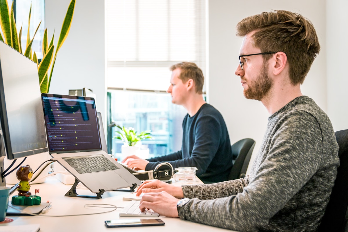 The team at their desks on a programme